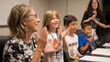 © Attasit - Teacher and students celebrating learning milestones with applause.