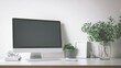 © ICKK - Modern home office workspace with computer monitor, office supplies, and decorative plants on a clean desk, minimalistic design, bright aesthetic