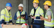 © peopleimages.com - Man, checklist and group at construction site for meeting, review and planning for renovation project. Lead engineer, clipboard and team for advice, listen or problem solving for property development