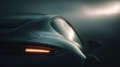 © Aris Suwanmalee - A sleek sports car tail light shines in the fog, embodying elegance and speed.