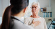 © peopleimages.com - Consulting, chest pain and healthcare with old woman and doctor for cardiac rehabilitation, heart arrhythmia or medical. Cardiologist, help and advice with people for healing and breathing exam