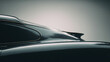 © Aris Suwanmalee - Elegant car silhouette showcasing sleek design and glossy finish under soft lighting.