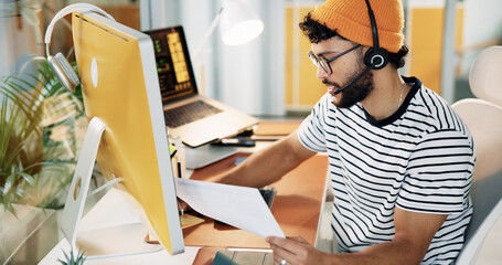 Aufkleber - Businessman, computer and document for creativity, article presentation or review in creative office. Journalist, headset or tech in agency for video call, topic research or thinking for planning