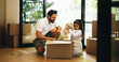 © AzeemudDeen/peopleimages.com - Packing, box and girl with father for moving, property relocation or smile in new home. Child, kid and dad with package for mortgage, real estate loan or help for unboxing belongings in dream house