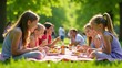 © Gayan - Family Enjoying Picnic In Summer Park