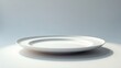© Rizvan - White plate against a white backdrop