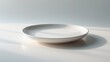 © AIArtistry - Cooking accessory: ceramic plate on a white surface