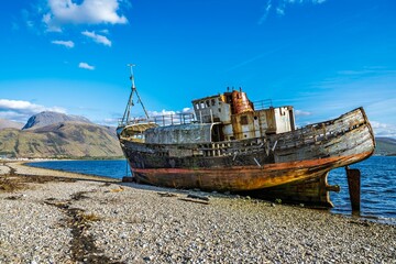 Naklejka na meble Corpach Wreck or Old Boat of Caol and Nevis Range Mountains, Caol Beach, Corpach, Fort William, Highland, Scotland, UK