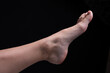 © yanik88 - Barefoot feet, on black background. Close-up shot of healthy beautiful female feet. Health and beauty concept. Top view of human foot with neutral manicure or pedicure