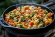 © Aysha - A vibrant vegetable stir-fry with bell peppers, broccoli, and carrots in a cast-iron skillet
