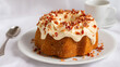 © Thisisbest - Delicious Maple Bundt Cake with Cream Cheese Frosting and Crispy Topping on a White Plate