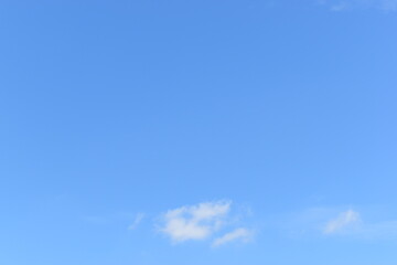 Wall Mural - beautiful blue sky and white fluffy group of clouds with sunrise in the morning, natural background