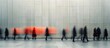 © Margarita - Blurred silhouettes of people walking in different directions against a tall concrete wall with a streak of orange light, conveying motion and urban anonymity