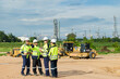 © Quality Stock Arts - Engineer team project planning outdoor survey team, industry factory construction site. teamwork meeting . cooperation workers
