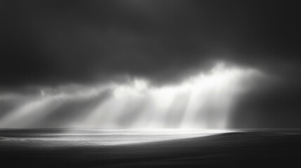 Wall Mural - dramatic rays of light breaking through stormy clouds, highlighting the contrast between darkness an