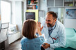 © Davor - Happy pediatrician giving high five to child patient during doctor visit in medical clinic