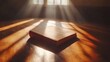 © Rezeki - Still life of a book spread on a wooden surface illuminated by soft sunlight