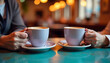 © Yasin - A cozy cafe scene with two people sharing coffee over a casual, relaxed conversation.