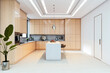 © Who is Danny - Modern minimalist kitchen interior with light wood cabinets, central island, and sleek lighting in contemporary luxury home setting. 3D Rendering