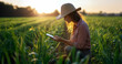 © .shock - Farmer using tablet to analyze smart field data and monitor wheat quality on a digital farm. Generated imag