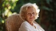 © Postmodern Studio - Tranquil moments: elderly woman relaxing outdoors in nature