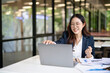 © maeching - Happy and excited young Asian woman after discussing successful project at work and working concept at office.