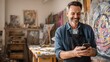 © Adel - Artist using phone in studio for art business marketing and social media promotion online content creation