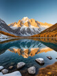 © Lauren - majestic snowcapped mountain range reflected in a crystalclear alpine lake golden hour light bathes the landscape in warm hues creating a breathtaking panoramic vista
