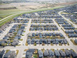 © Scott Prokop - Suburban neighborhood with many houses and a few cars