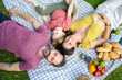 © bigy9950 - Top view of happy family spending time on holiday. mother, father and little son having picnic in nature on a summer day. Leisure, summer, childhood, relax concept.