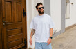© San4ezz007 - White T-shirt on a bearded hipster in sunglasses — urban mockup for brands