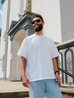 © San4ezz007 - White T-shirt on a bearded hipster in sunglasses — urban mockup for brands