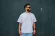 © San4ezz007 - White T-shirt on a bearded hipster in sunglasses — urban mockup for brands