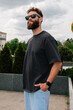 © San4ezz007 - Bearded hipster in black t-shirt and sunglasses — urban mockup for brands