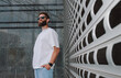 © San4ezz007 - White T-shirt on a bearded hipster in sunglasses — urban mockup for brands