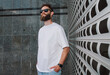 © San4ezz007 - White T-shirt on a bearded hipster in sunglasses — urban mockup for brands