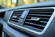 © NikahGeh - Close-up view of a modern vehicle's interior air vents.