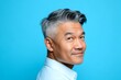 © R - Graphic artwork of style for aging men. Blue solid background. A chic and vibrant male with effortless elegance. Elegant men's wavy fringe haircut - midlife asian man with short hair.