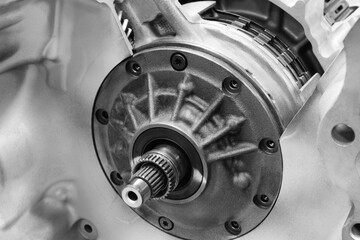 Aufkleber - A close up of a car engine with the transmission and gears visible. Concept of complexity and intricacy, as the various components of the engine work together to power the vehicle