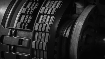 Aufkleber - A dark black close up of a machine with many gears and discs. concept of powerful industrial energy of complexity and intricacy, and a sense of awe at engineering behind machine.