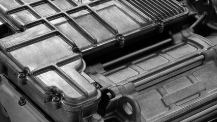 Aufkleber - A close up of a car engine with a black and white filter. The engine is made of metal and has a lot of bolts and screws. Concept of industrial and mechanical nature