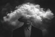 © btiger - Mysterious person wearing a suit and hat blended with a large cloud concealing the upper face, creating a surreal and moody atmosphere