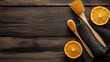 © Sampao - Cleaning brushes and cloths arranged with citrus-based natural cleaners on a wooden surface