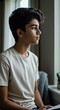 © Mauricio - Teenager looking out window profile shot portrait of young man with dark hair indoors shot