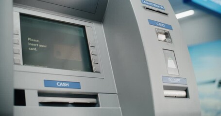 ATM Machine in Airport Terminal: Man Inserting Card, Pressing Buttons on ATM Keypad, Entering PIN Code for Money Withdrawal Operation. Cash Machine, Banking Services and Transactions. Close Up Shot.