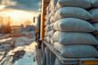 © MVProductions - row of raw cement bag stack on truck site construction ideas concept