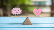 © Nattavee - heart balancing on a scale to represent emotional intelligence