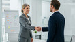 © rezasrz - Business People Handshake in Office Meeting with Positive Agreement
