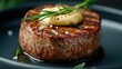 © ProPhotos - Close-up of steak with grill marks, rosemary sprigs, and garlic butter melted on top.