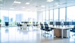 © SSuperTier - A softly blurred office interior with neutral tones and open-plan desks creates a clean, modern corporate atmosphere. Natural light streams through large windows, casting subtle highlights across the